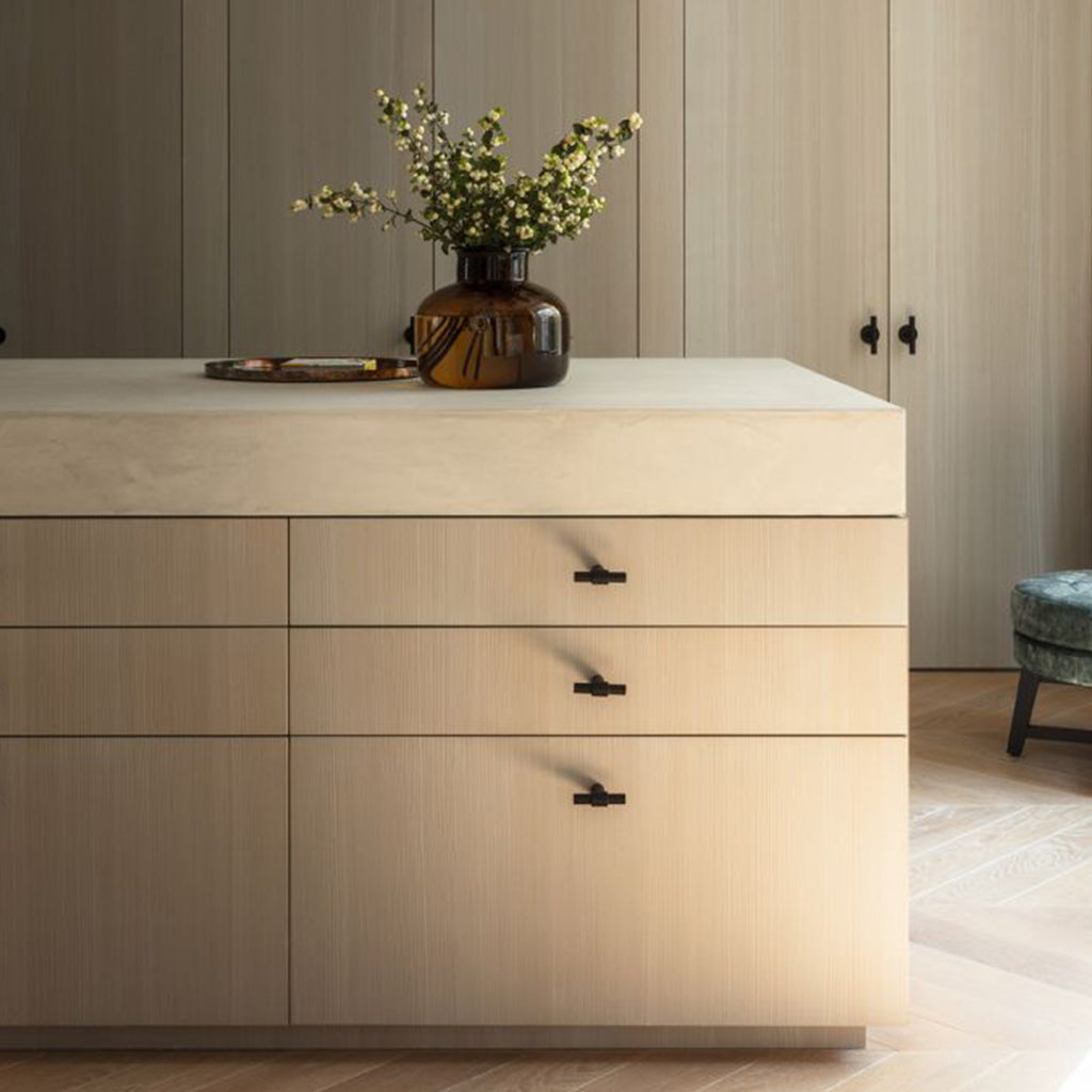 Modern Black Cabinet Hardware on oak drawers and cabinet doors.