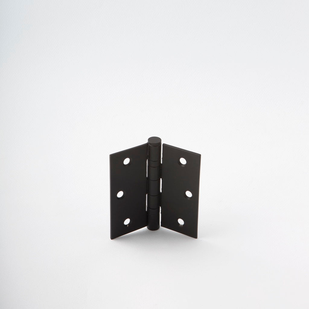 Classically designed black door hinge.