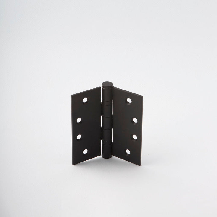 Classically designed black door hinge.