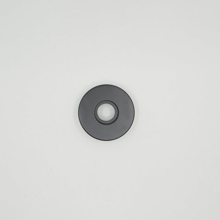 A black AHI Roses for Door Levers is sitting on a white surface.