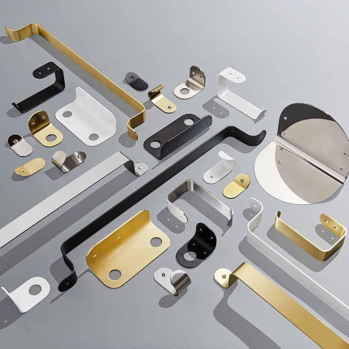A group of BENDE Shelf Ledges by CSSN on a gray surface.