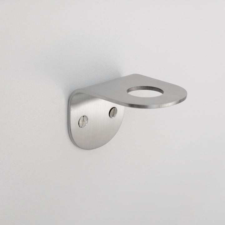 A close up of a CSSN BENDE Soap Holder Bracket Single on a wall.