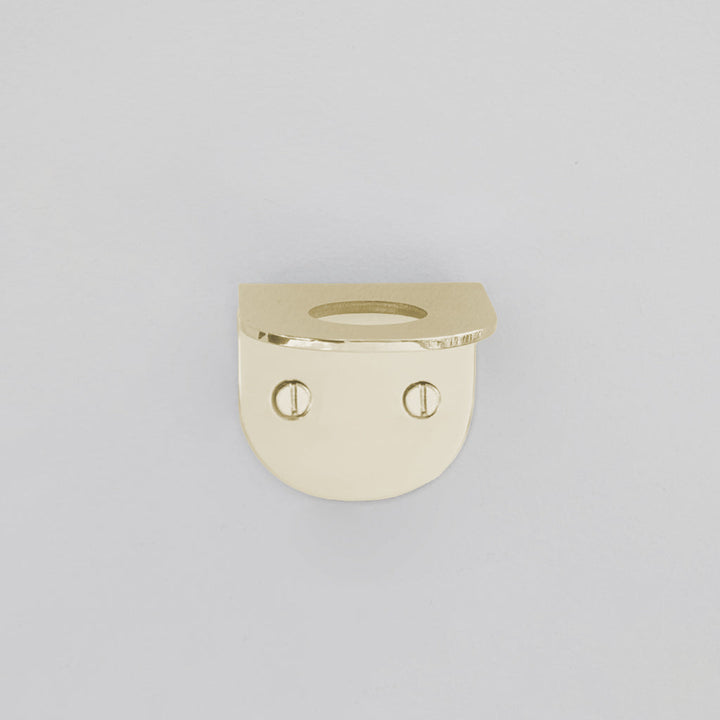 a gold ring with a face on it.