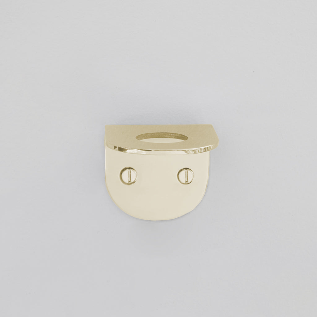 a gold ring with a face on it.