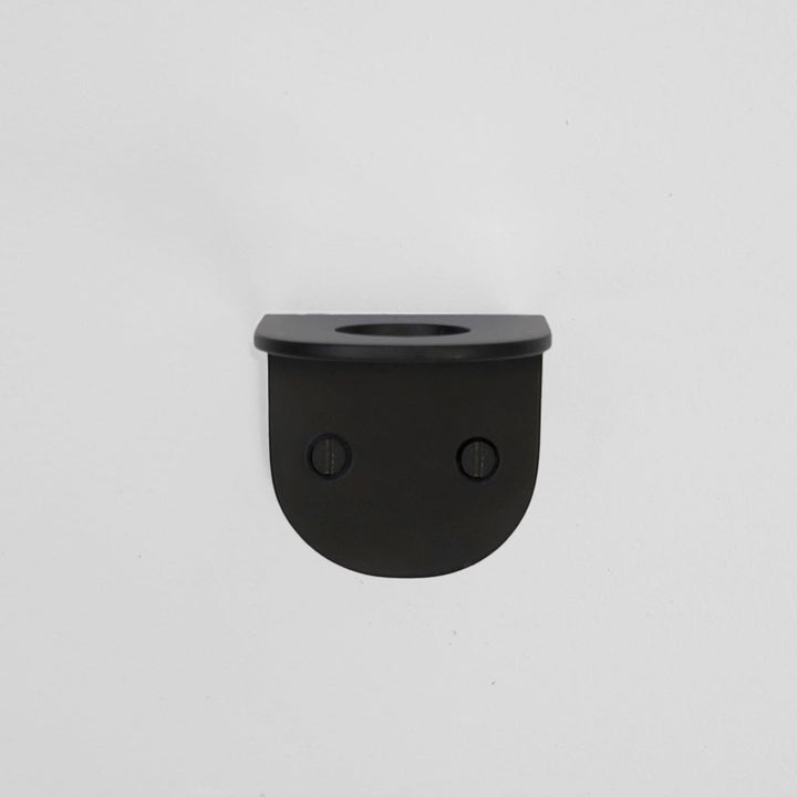 A CSSN BENDE Soap Holder Bracket Single is hanging on a white wall.