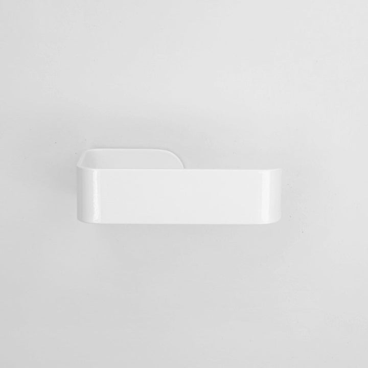 A close up of a CSSN BENDE Toilet Roll Holder on a wall.