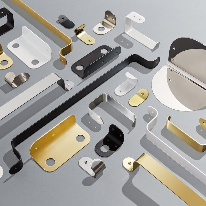 Patchwork flat lay of Bende collection on grey background with high contrast shadows showcasing the clean lines and soft curves