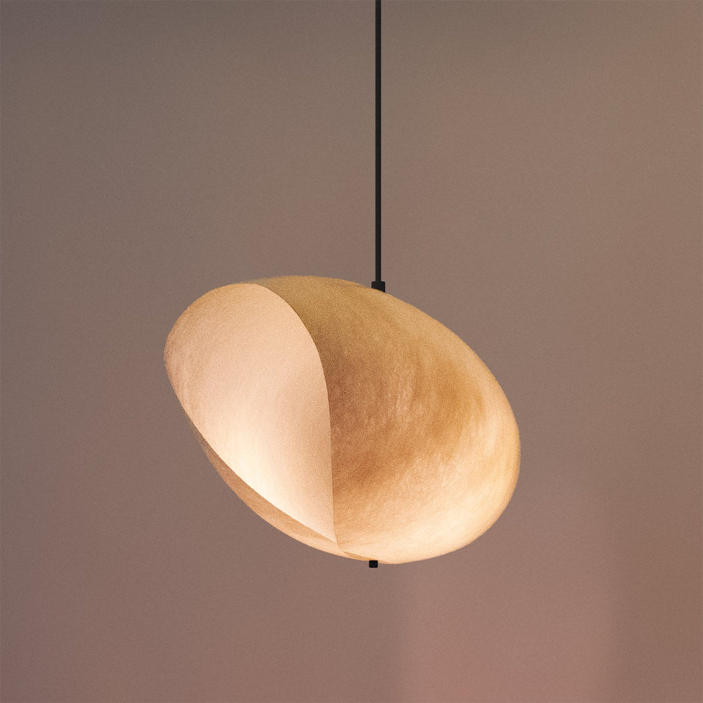 The Culotte Pendant Lamp adds poetic softness with its sculptural fiberglass shade, diffusing light with an ethereal glow and organic movement.