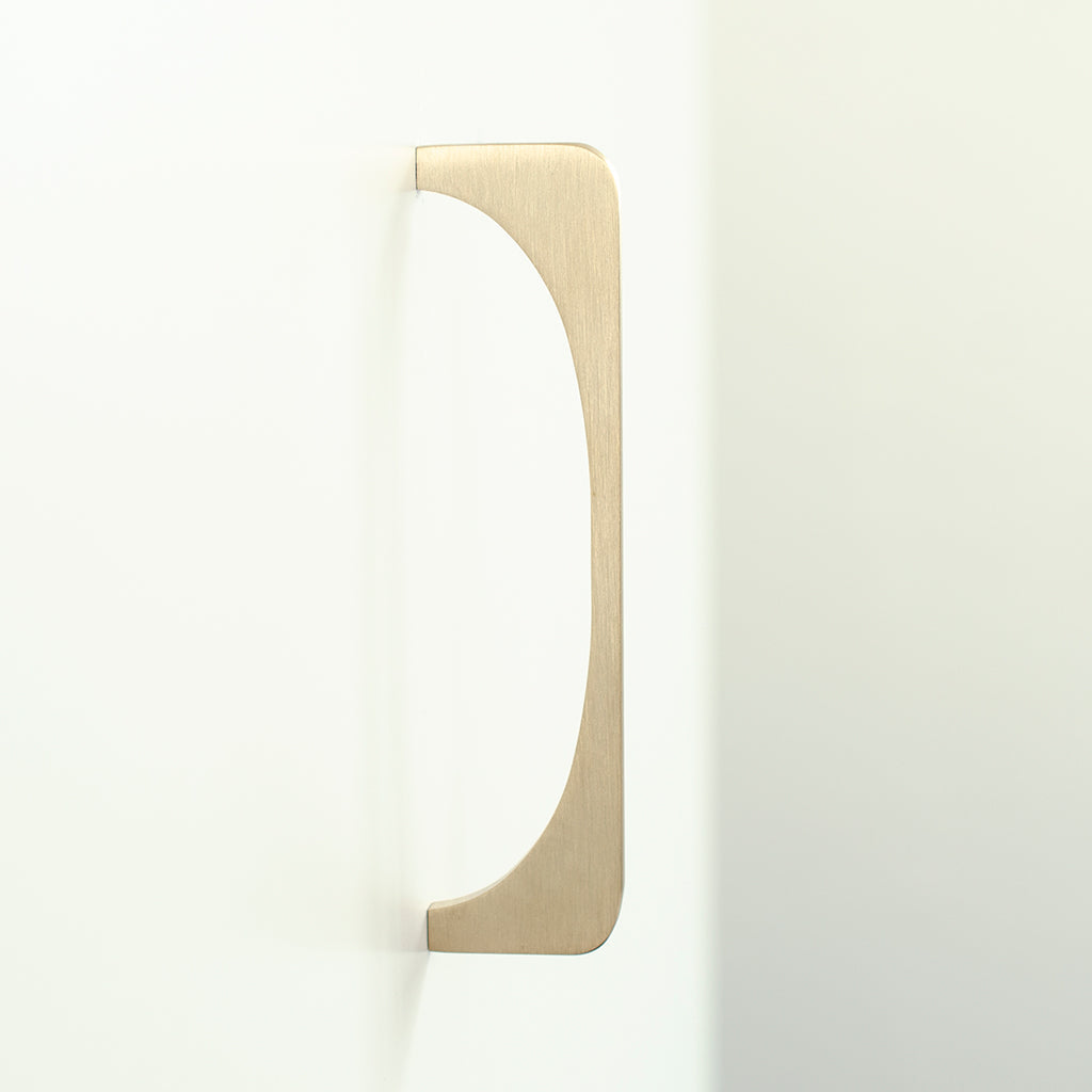 A Baccman Berglund Bridge Pull on a white wall.