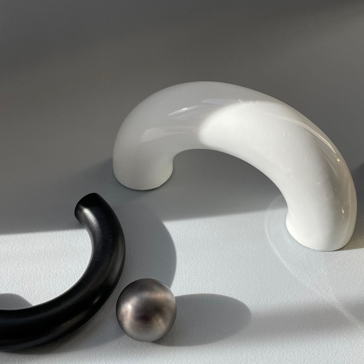 solid cast natural and white brass and bronze small cabinet hardware knob and handle by Maha Alavi