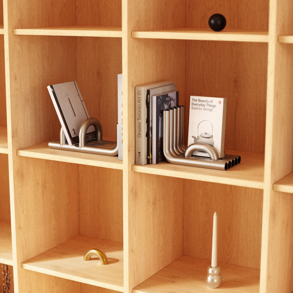 A collection of Maha Alavi hardware and designs in a wooden shelf