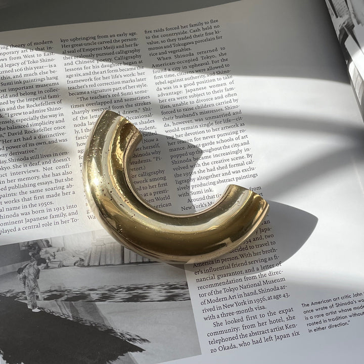 solid cast natural and white brass and bronze curved cabinet hardware handle by Maha Alavi