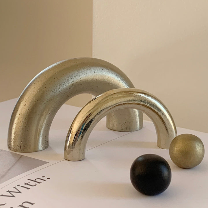 solid cast natural and white brass and bronze curved cabinet hardware handle by Maha Alavi