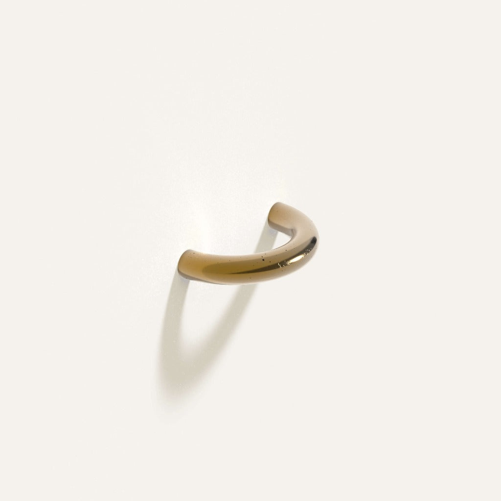 Satin brass Maha Alavi Cercle thin pull, a slender cast half-circle arc.