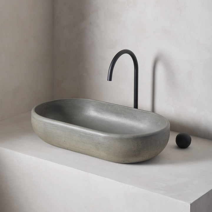 An oversized, obround washbowl with softened curves and high, round-over basin walls