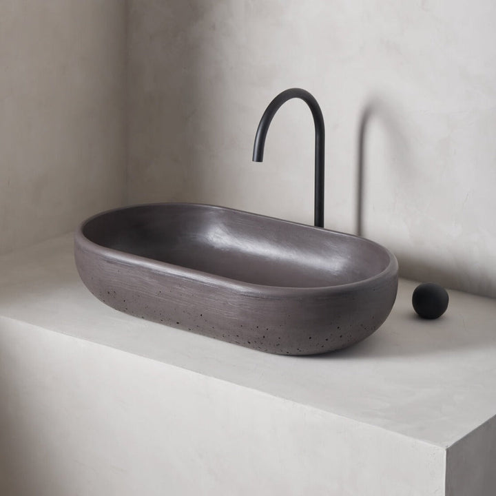 An oversized, obround washbowl with softened curves and high, round-over basin walls