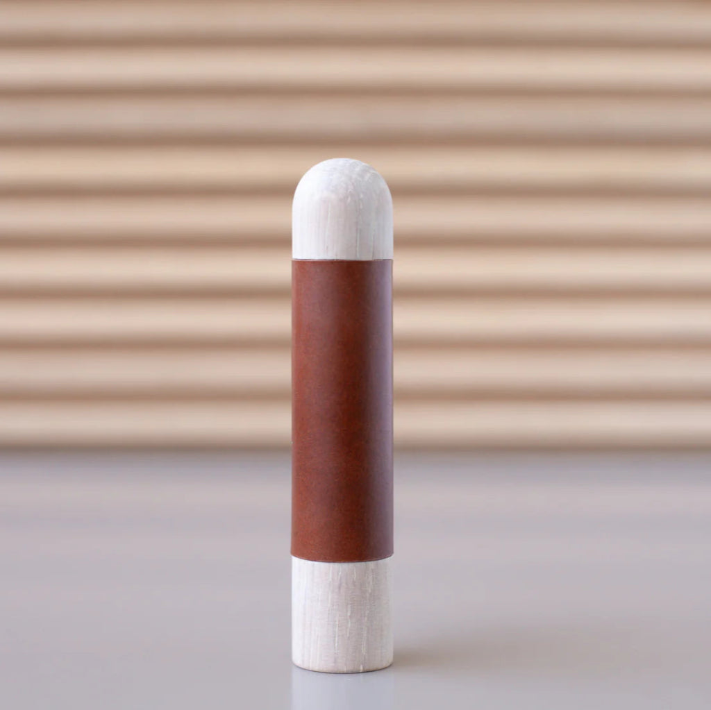 Chapman & Bose wood appliance bar pull with a ash body and a rust leather half-leather wrap.