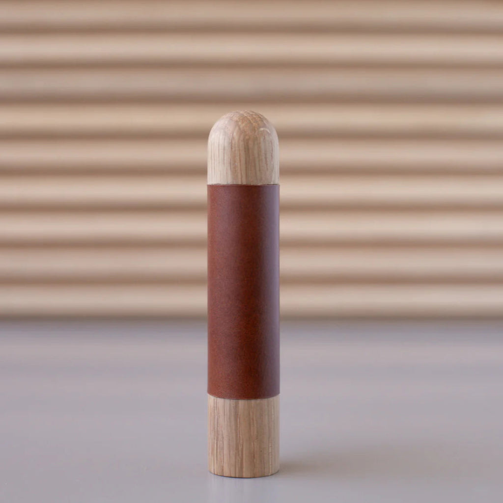 Chapman & Bose wood appliance bar pull with a oak body and a rust leather half-leather wrap.