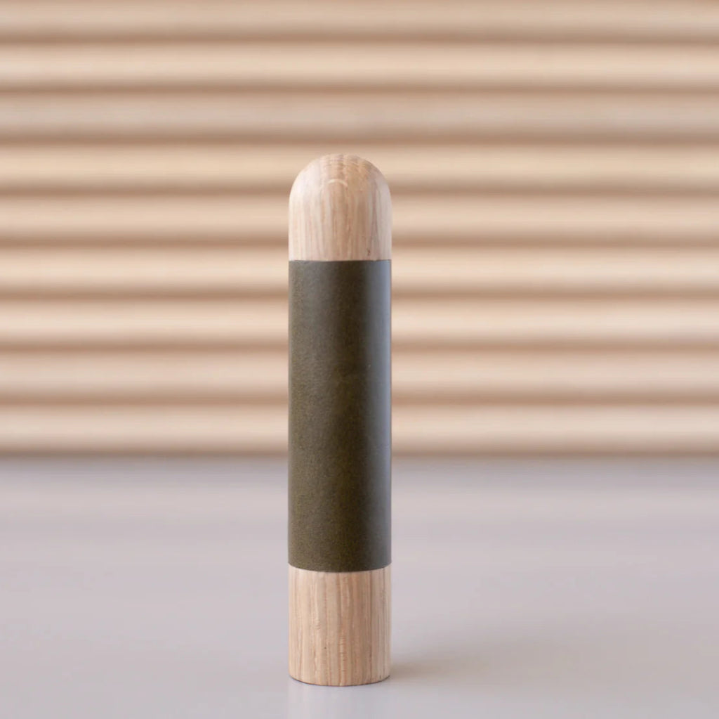 Chapman & Bose wood appliance bar pull with a oak body and a olive leather half-leather wrap.