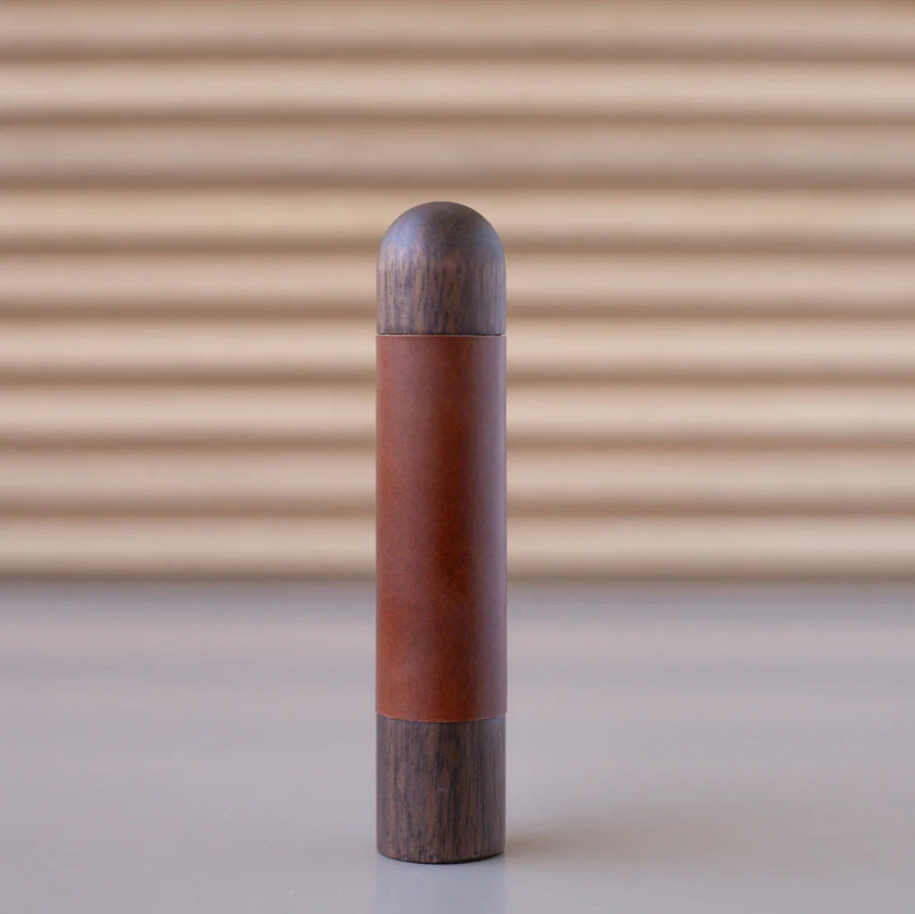 Chapman & Bose wood appliance bar pull with a walnut body and a rust leather half-leather wrap.