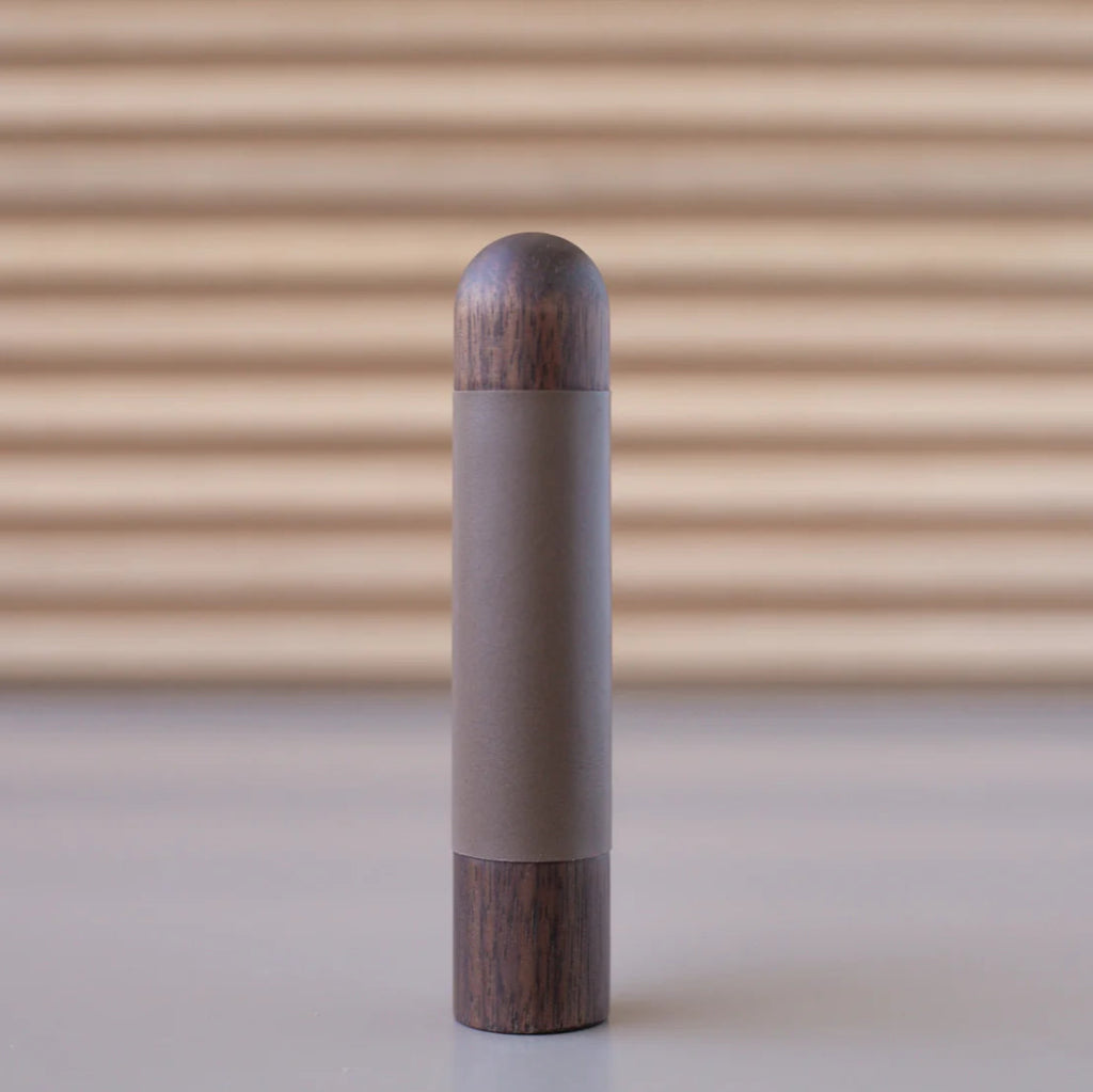 Chapman & Bose wood appliance bar pull with a walnut body and a taupe leather half-leather wrap.