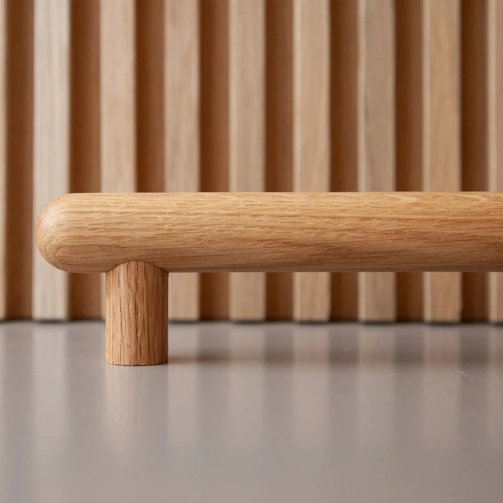 Oak wood Chapman & Bose bar pull, a turned round bar on two posts.