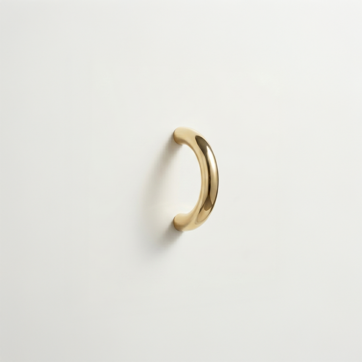The Charlie Arc Pull is a 3-inch round solid brass cabinet pull, available in 15 finishes and two profile depths.