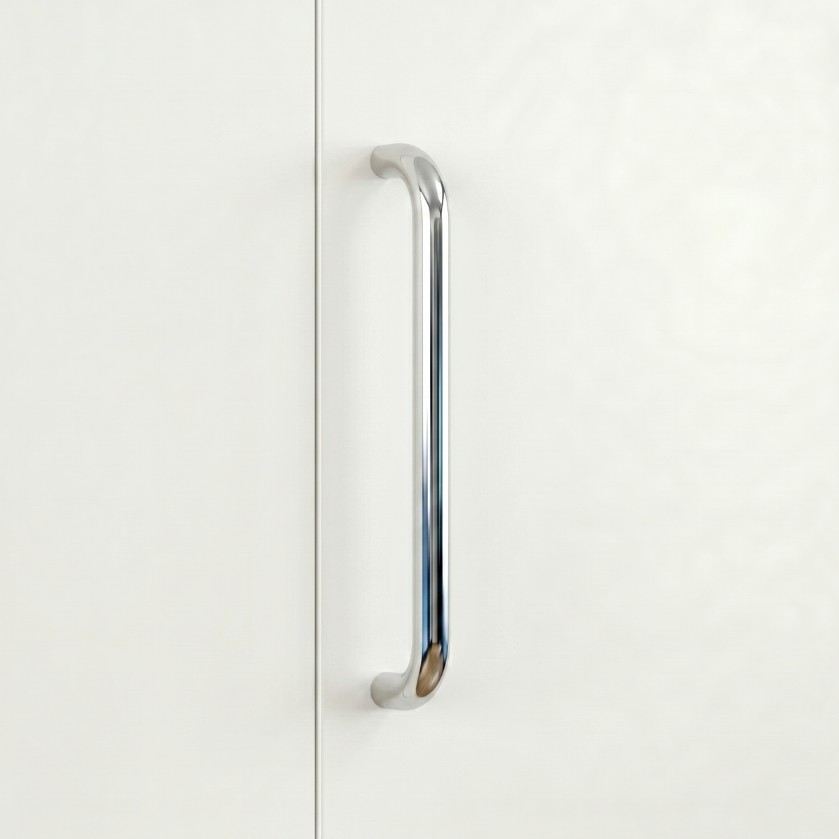 Polished chrome Charlie Radius cabinet and appliance pull, a D-shaped tubular handle with radiused corners, mounted vertically on cabinetry.