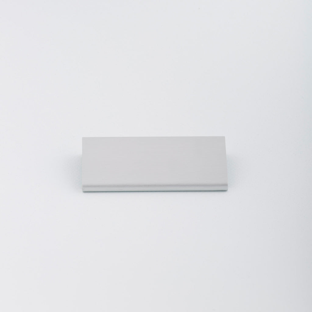 Simple Aluminum Tab pull with circular round edge profile. Made in Toronto.