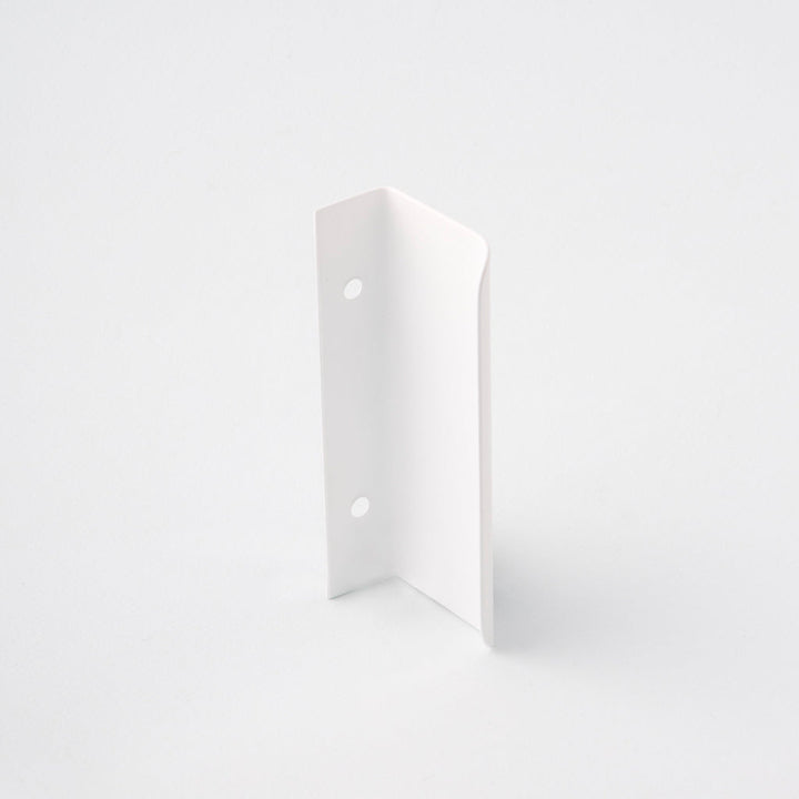 Short white tab pull for cabinets. Simple and minimal hardware. Made in Toronto. From the back.
