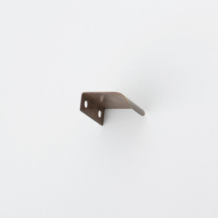 Side view of antique bronze tab pull for cabinets. Hardware made in Toronto.