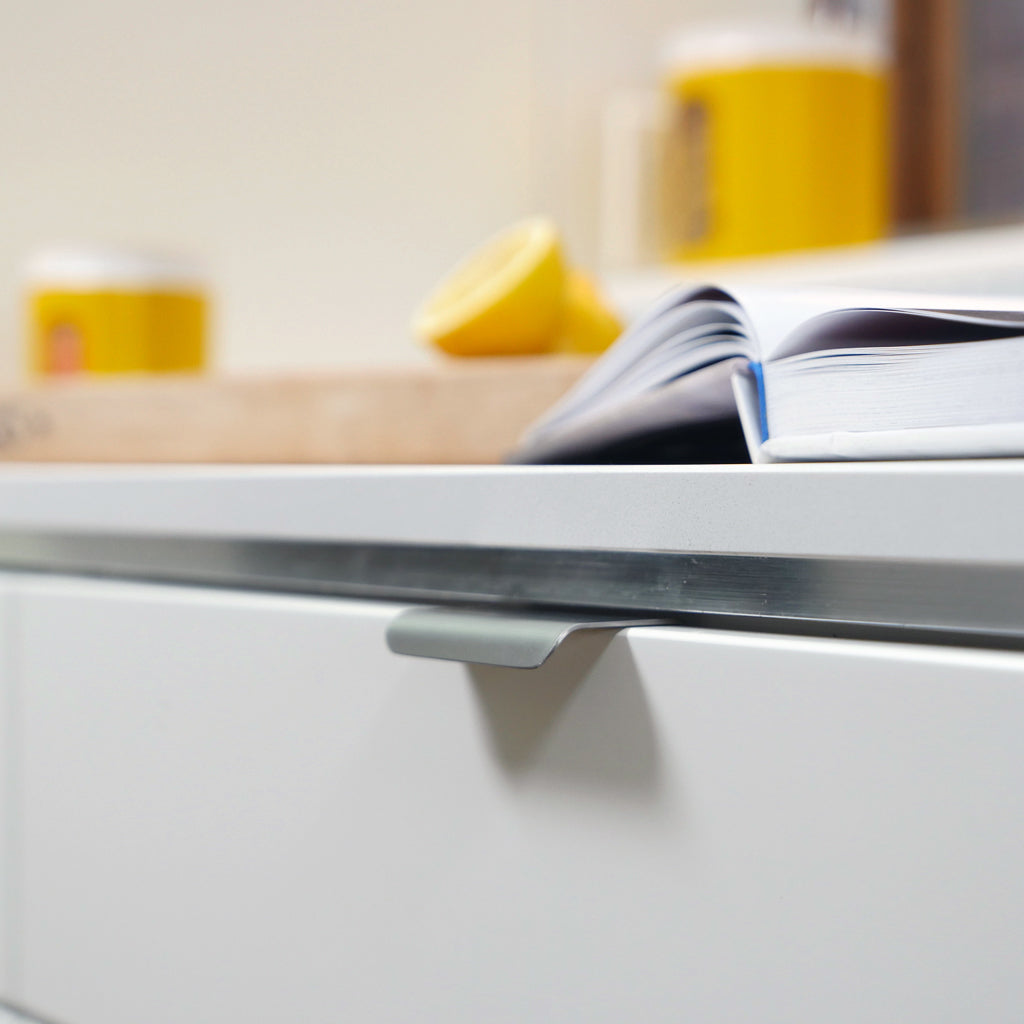 A close-up of a drawer with a CBH Charlie Tab Small book on it.