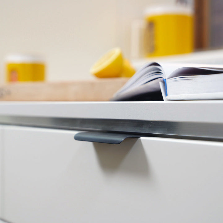 A close up of a drawer with a CBH Charlie Tab Small book on it.