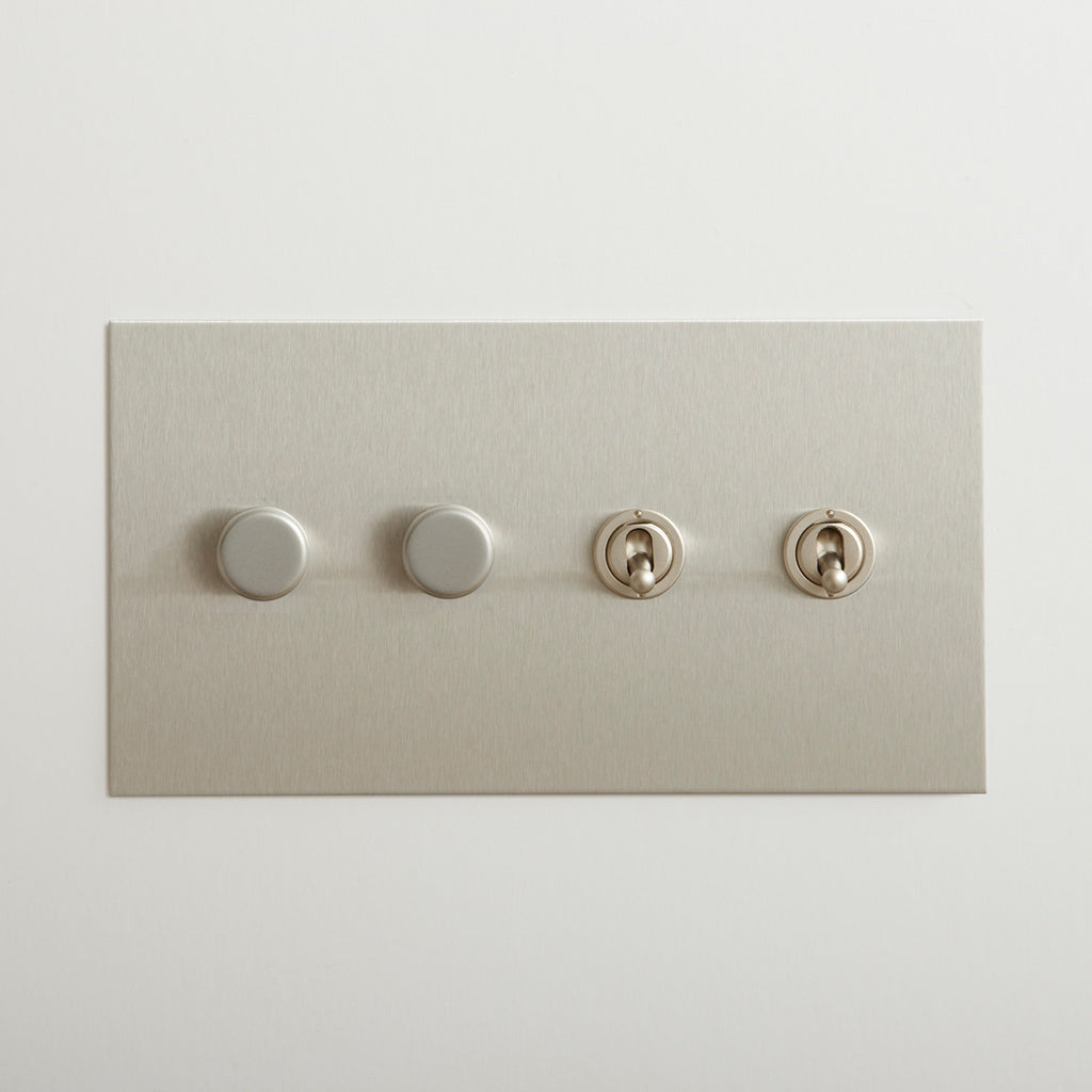 Nickel Forbes & Lomax switch plate with two dimmers and two toggles.