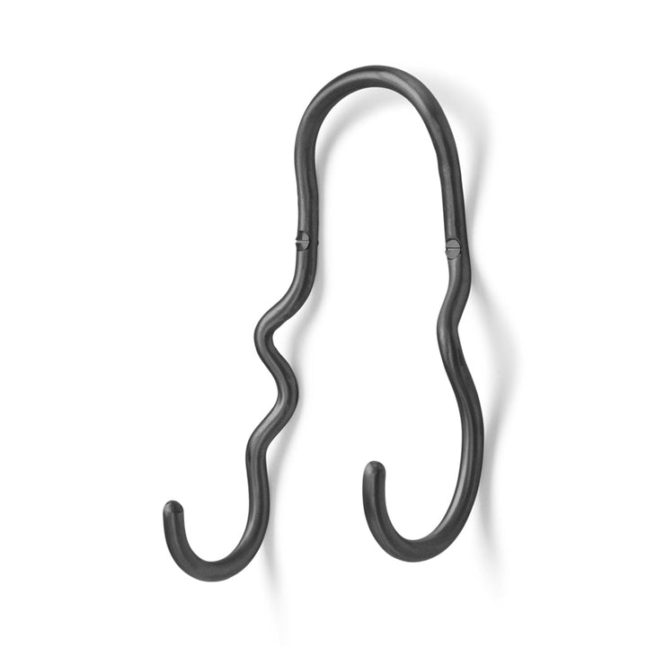 A Ferm Living Curvature Double Hook on a white wall.