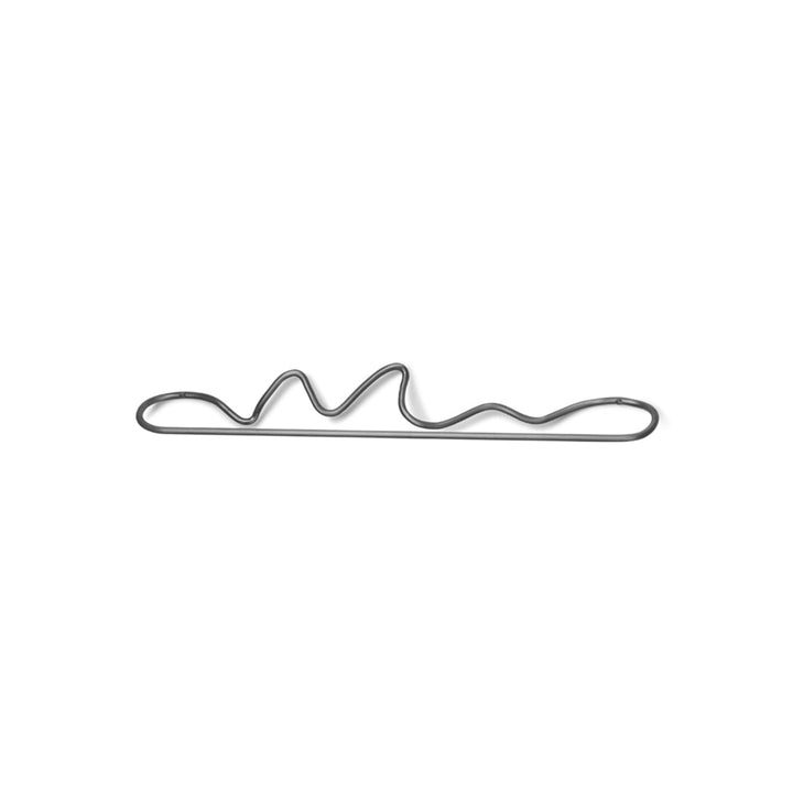 A Ferm Living Curvature Towel Bar on a white background.