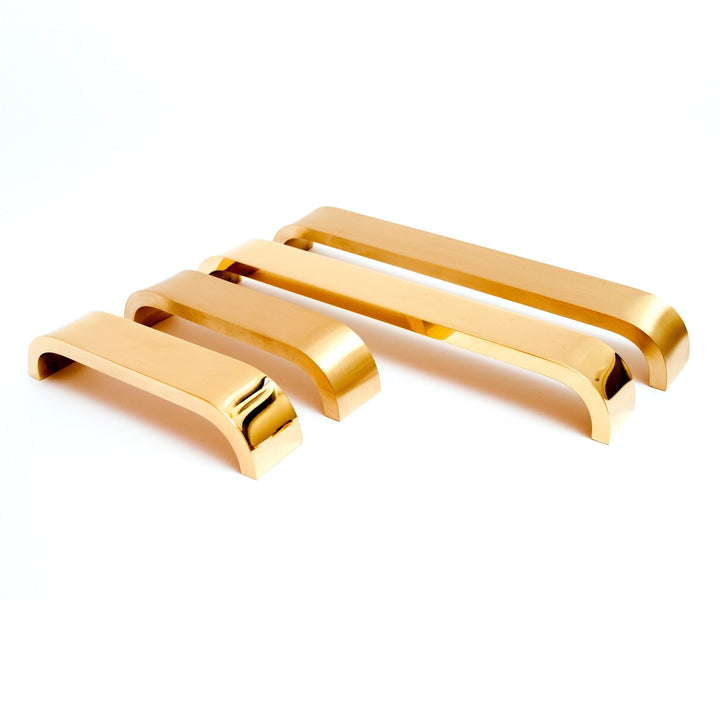 Brass curve handle and knob on modern cabinets.