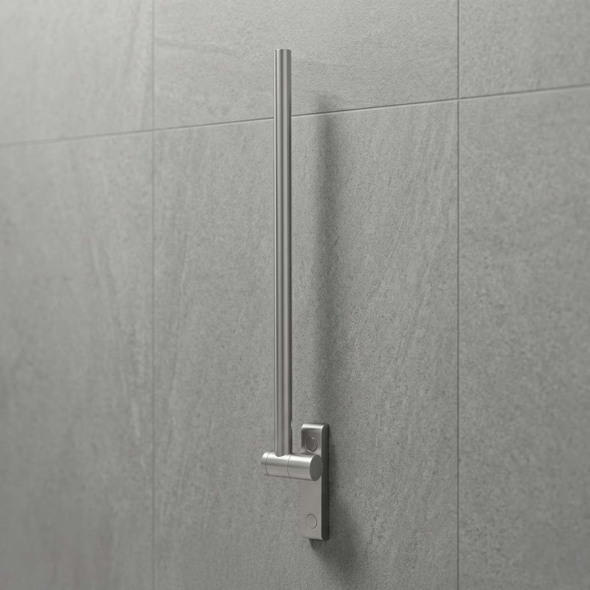 Metal fold up grab support bar mounted on a gray tiled wall in a bathroom
