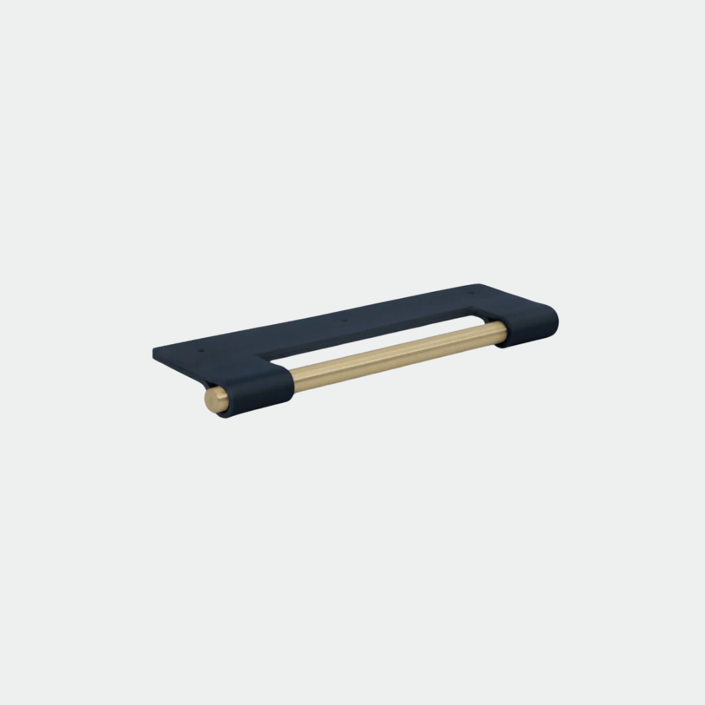 Navy Chapman & Bose EP03 leather edge pull with a brass core, wrapped over the drawer edge.