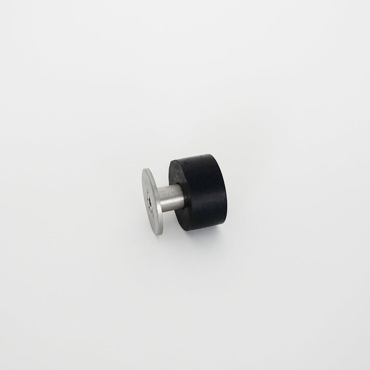 An AHI Extra Large Bumper Door Stop in black and silver on a white surface.