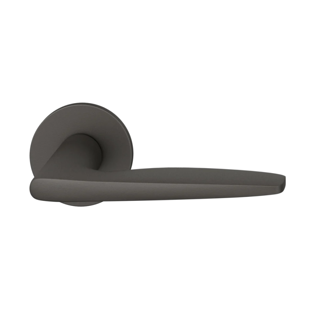 Dark bronze anodized FSB 1058 door lever, a tapered lever with a flowing silhouette, on a round rose.