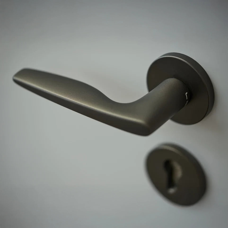 FSB 1058 lever and escutcheon at The Opus, Dubai, showing the tapered flowing form in situ.