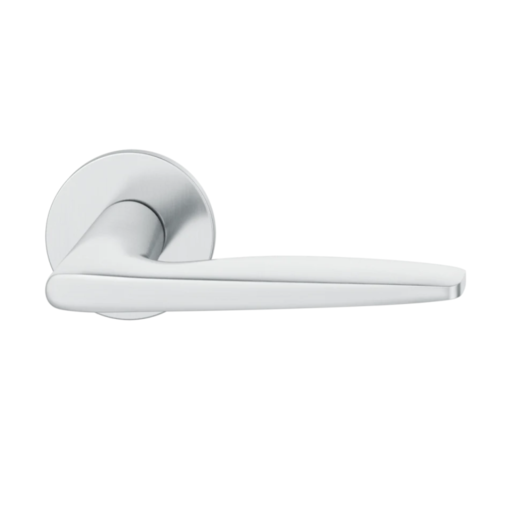 Satin stainless steel FSB 1058 door lever, a tapered lever with a flowing silhouette, on a round rose.
