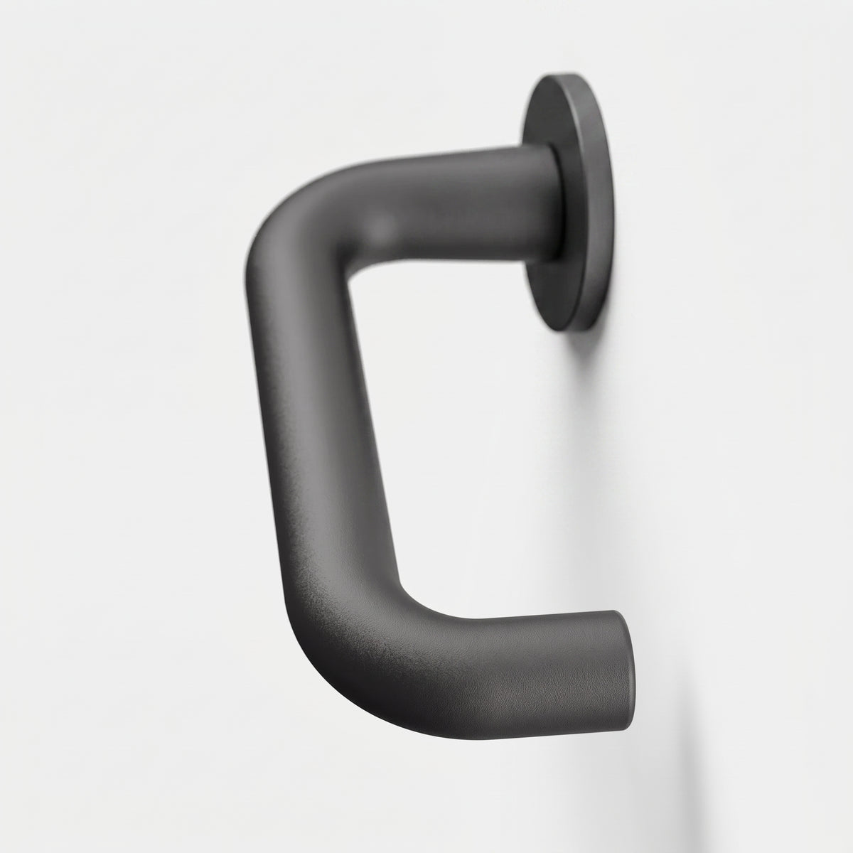 Matte black FSB 1070 U-shaped door lever with a closed return on a circular rose against a white background.