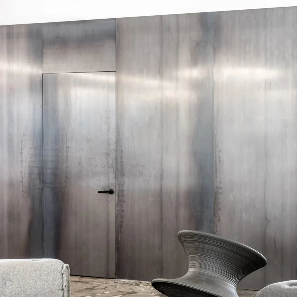 FSB 1075 levers on a dark metal-clad partition at the BIG office in New York.