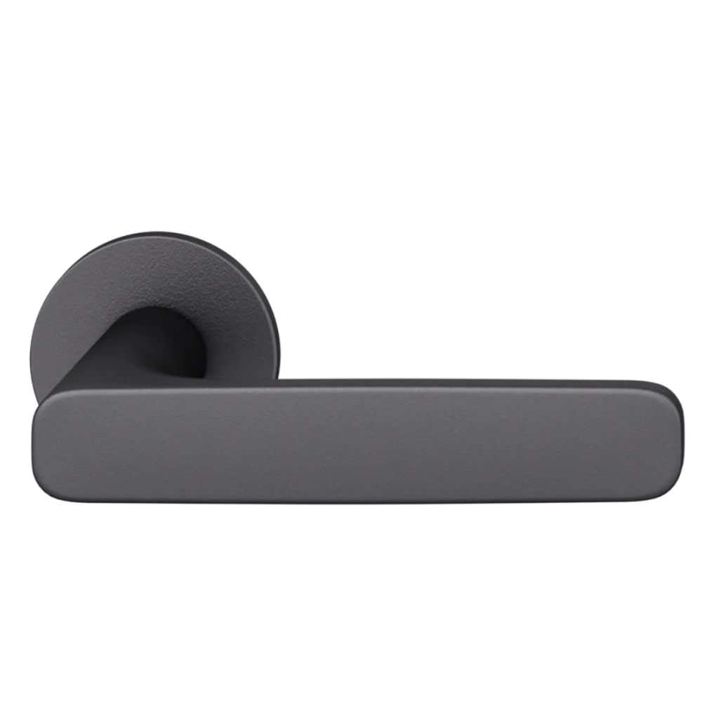 Black anodized FSB 1289 door lever, a convex flat-front lever on a round rose.
