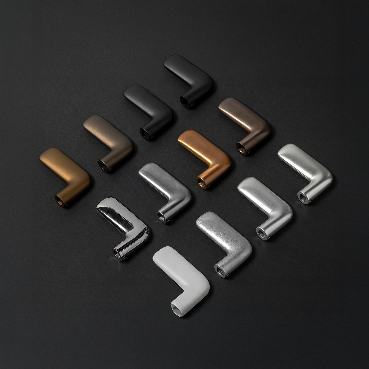 FSB 1291 levers arranged in a grid on a dark ground, shown across bronze, black, and stainless finishes.