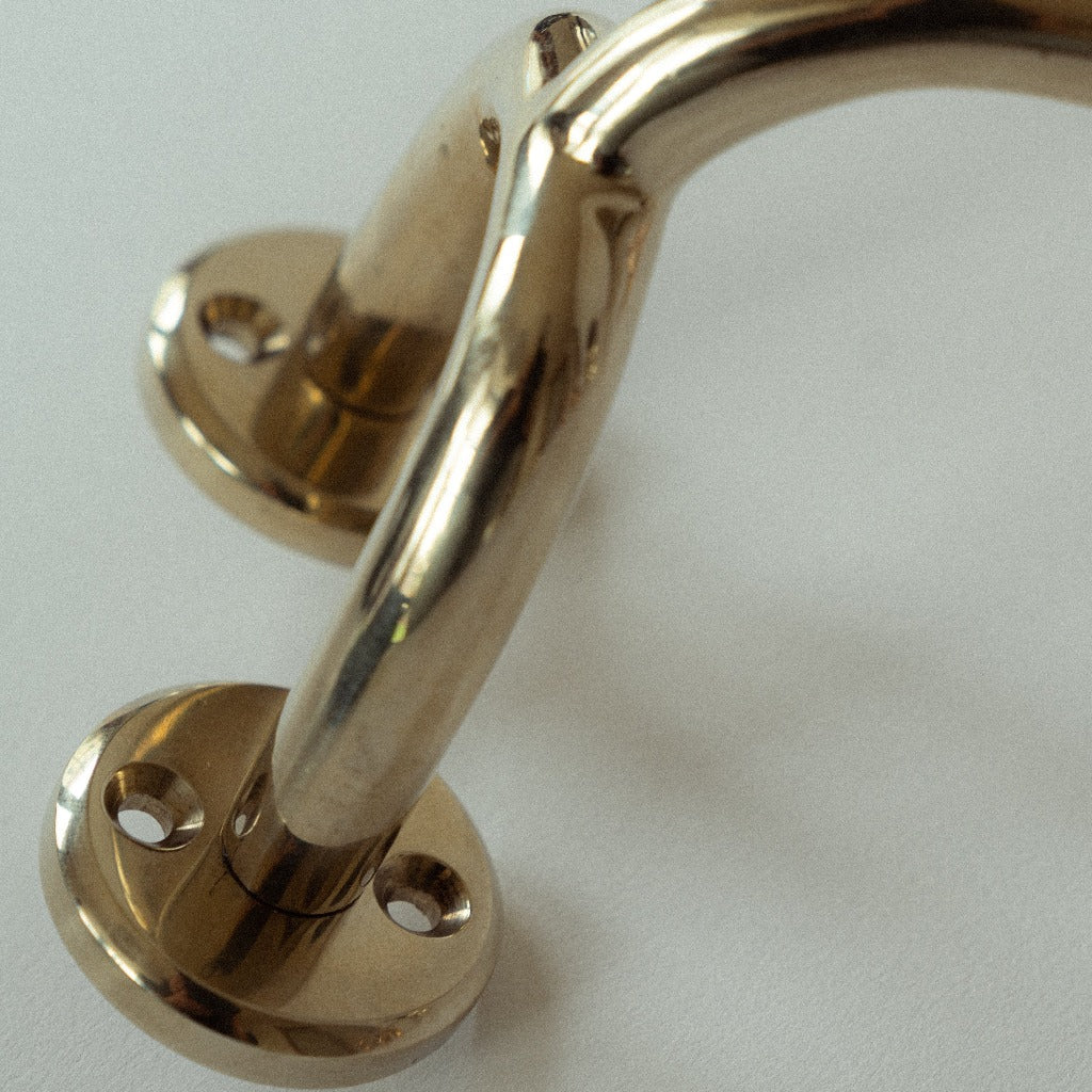 Brass Maha Alavi Fauna toilet paper holder, an organic cast bracket.