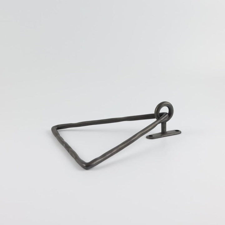 A Mi & Gei Forme No. 14 Triangle Towel Ring on a white surface.