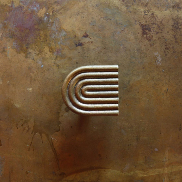 A close up of the Mi & Gei Libre Forme No. 9 Hook on a wall.